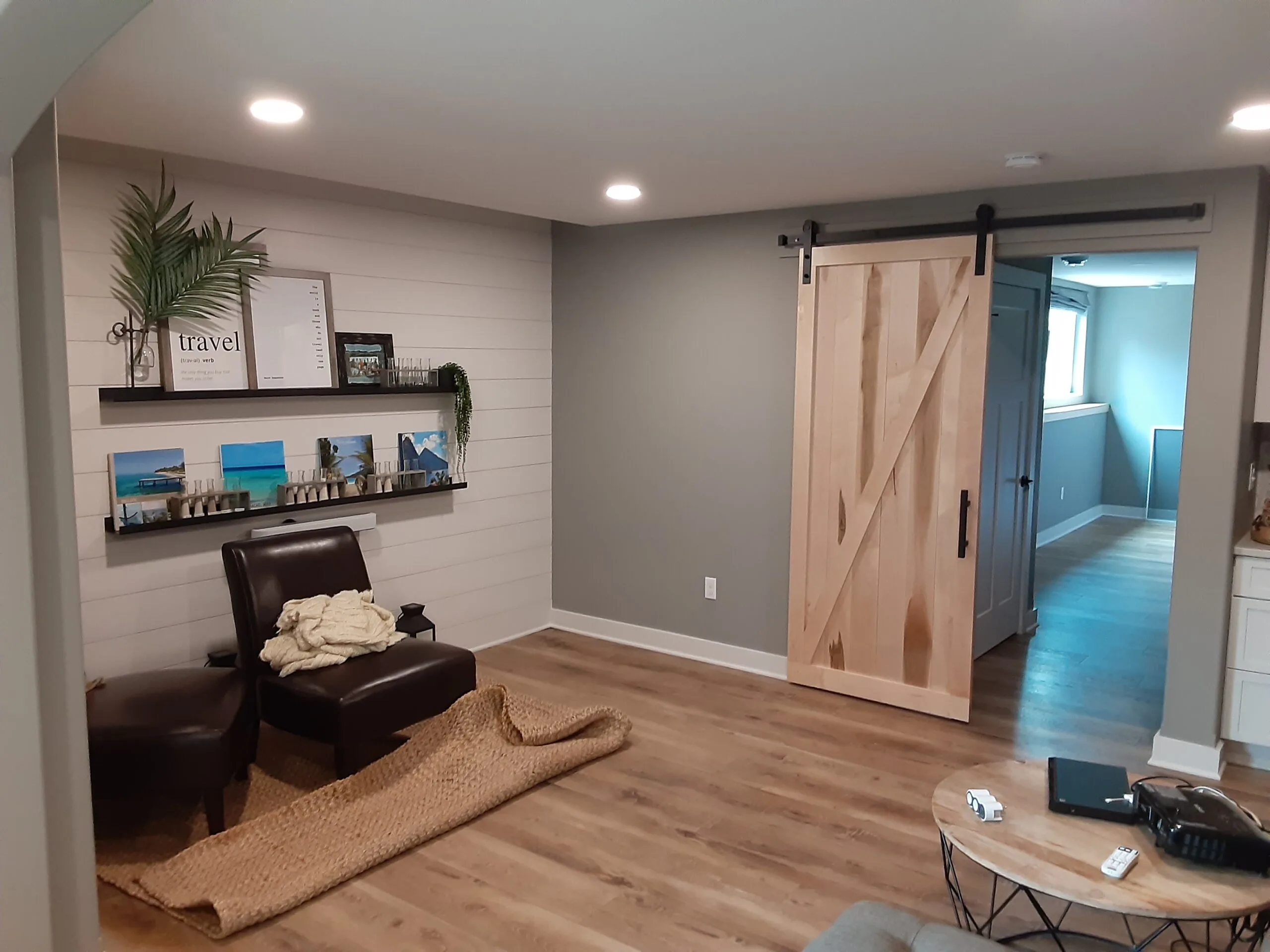 Basement living area with shiplap wall
