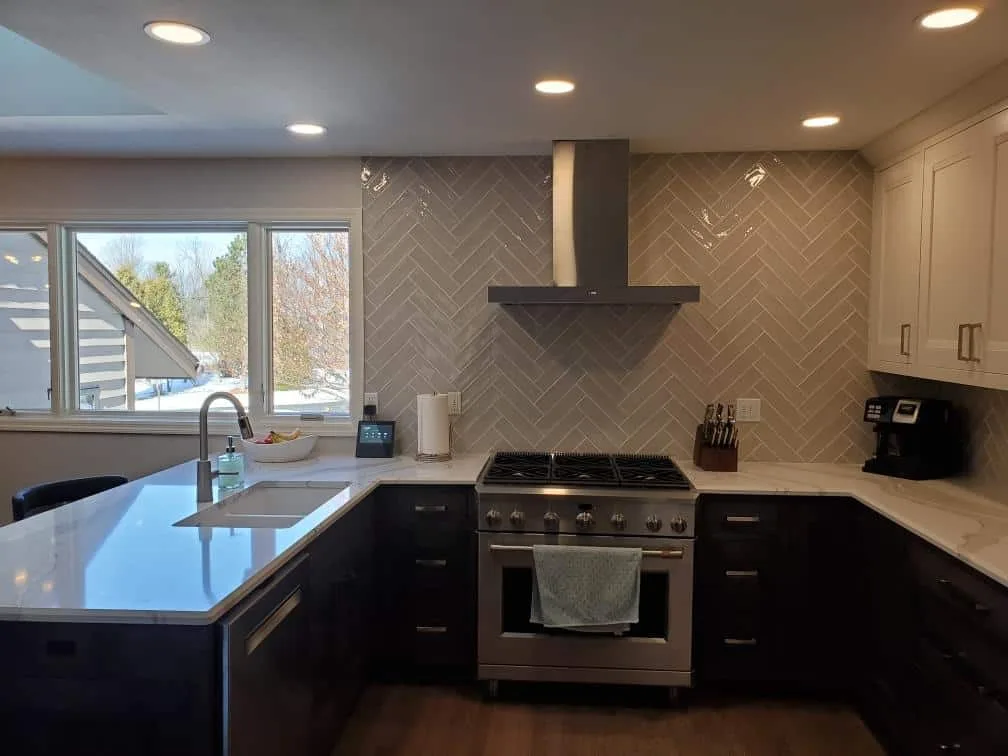 Kitchen with herringbone backsplash
