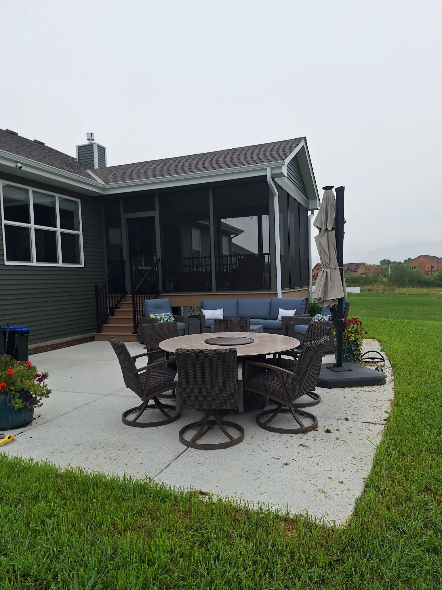 Covered screened porch with outdoor seating